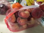 Huge tub of flat peaches